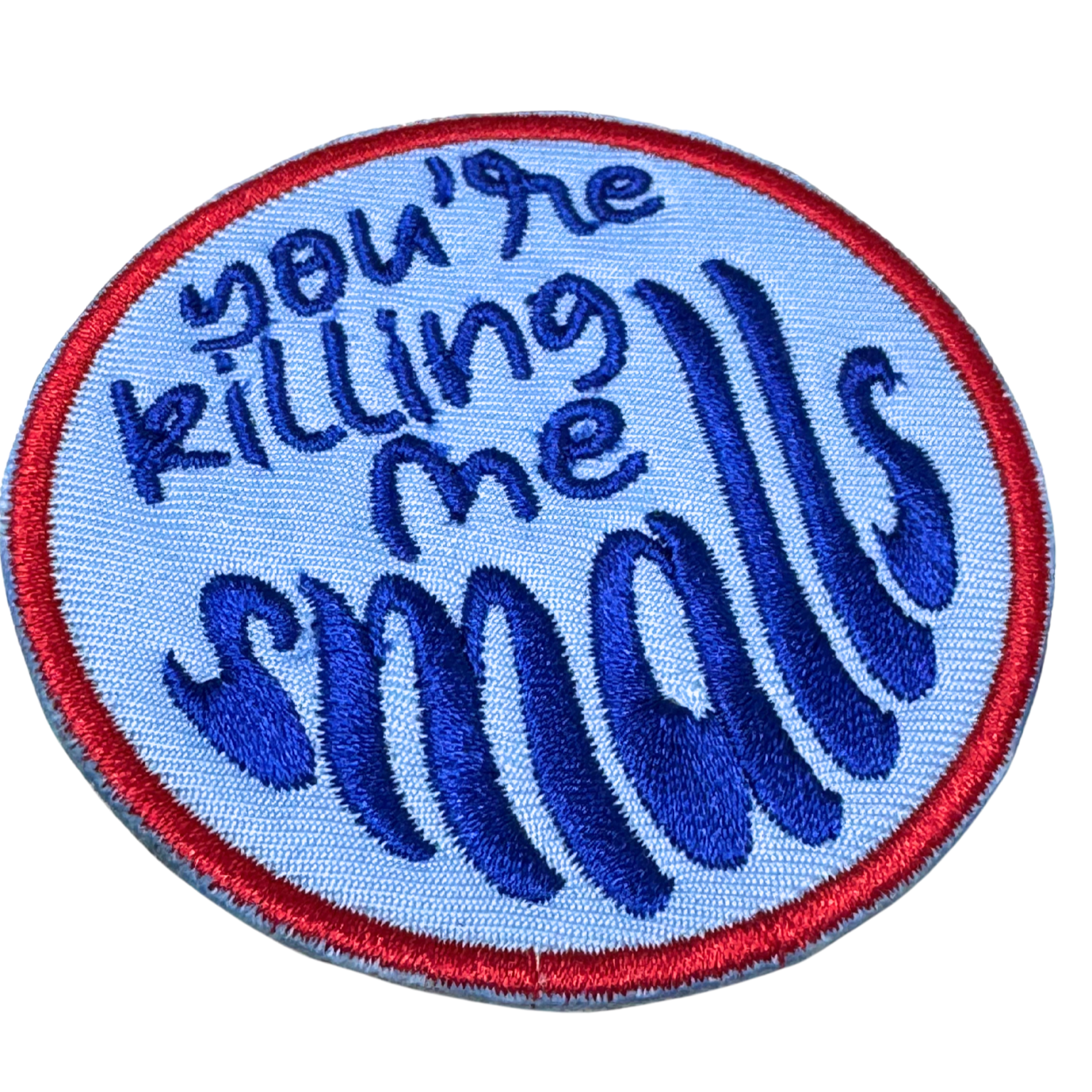 Side angle detail of embroidery stitches on the patch