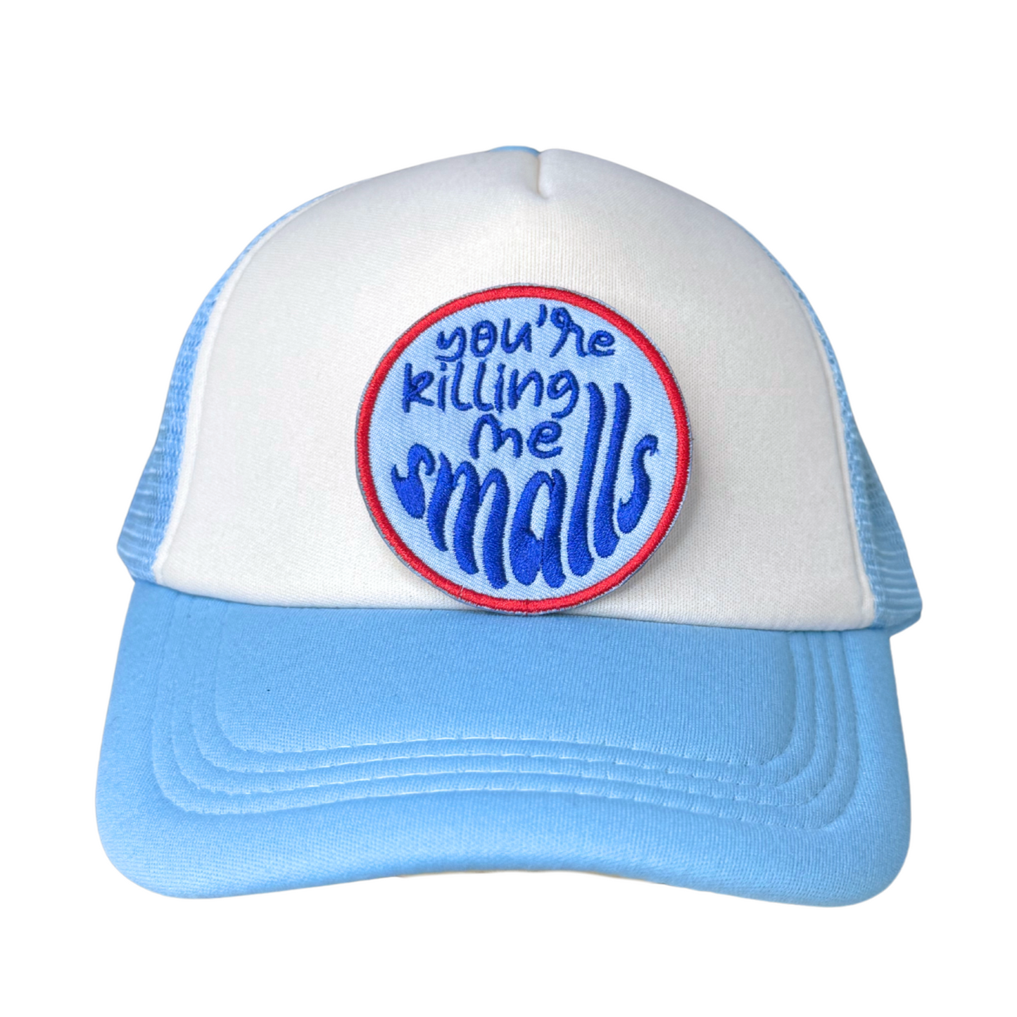 Patch ironed on to a blue and white trucker hat