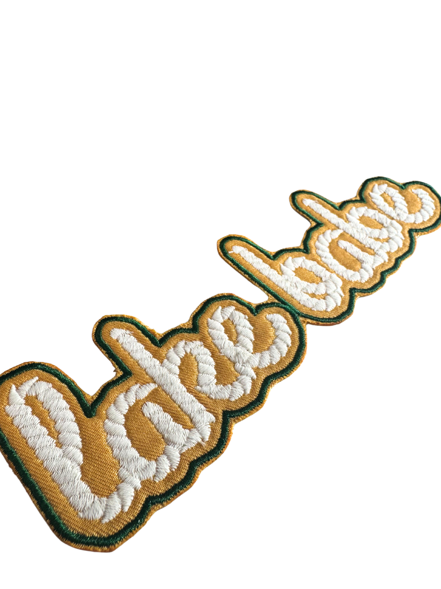 Close-up of retro-style lake babe patch showing gold fill and stitching detail

