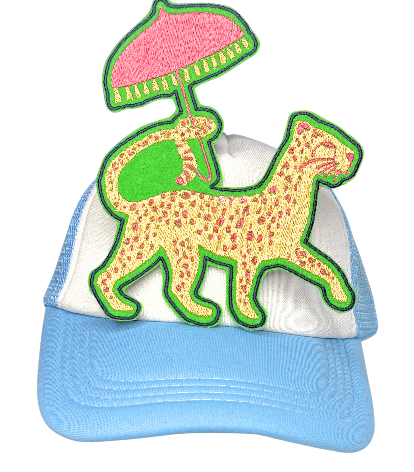 Leopard vacation patch with parasol ironed onto blue and white trucker hat

