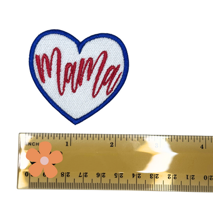 Mama heart patch next to a ruler for size reference