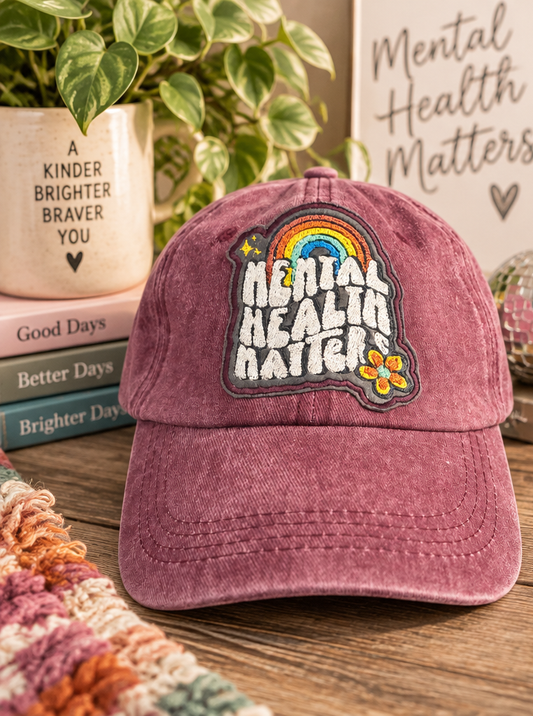 Mauve Mental Health Matters baseball hat styled with uplifting decor