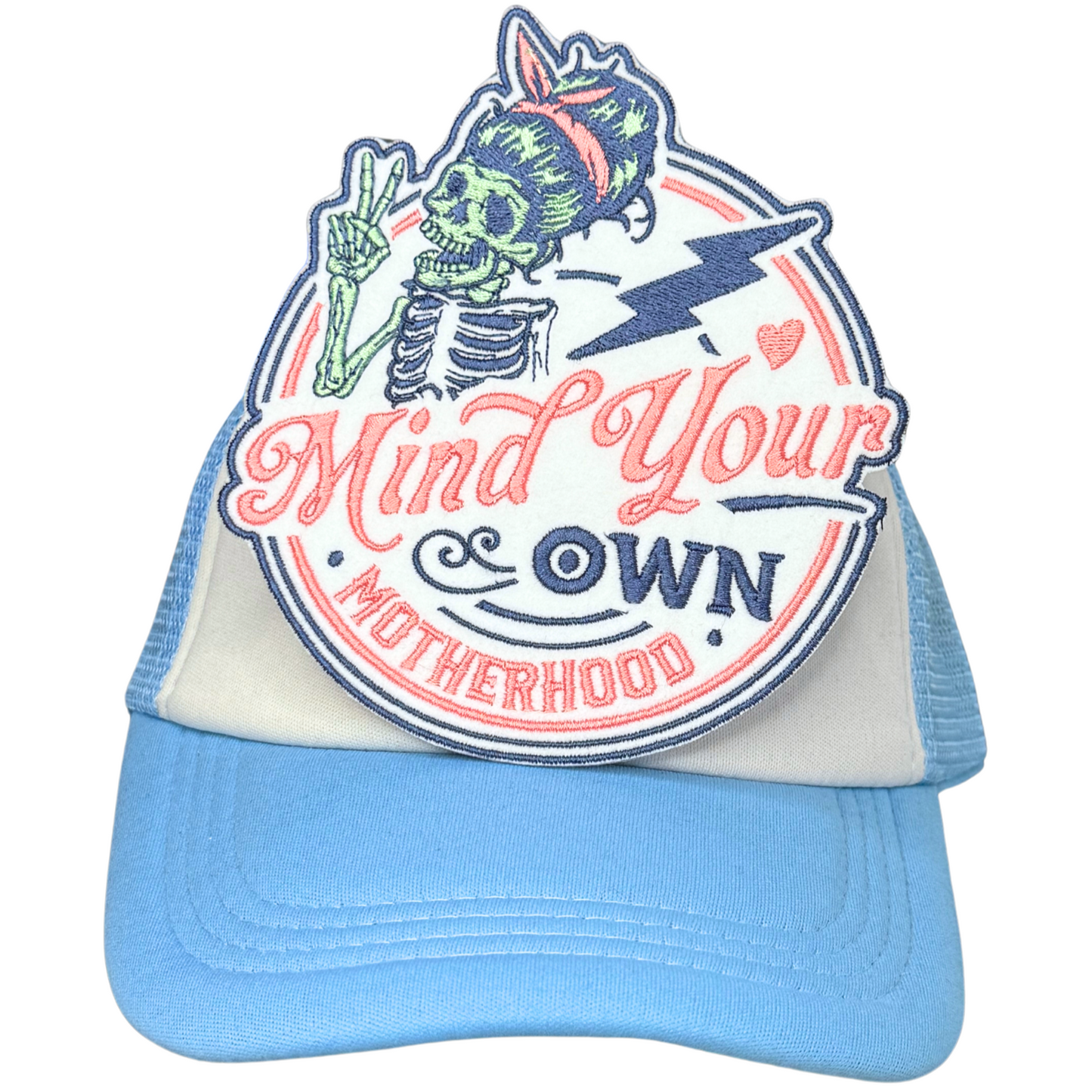 Bold embroidered motherhood patch ironed on white and blue trucker hat

