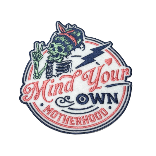 Skeleton mom embroidered patch with “Mind Your Own Motherhood” text
