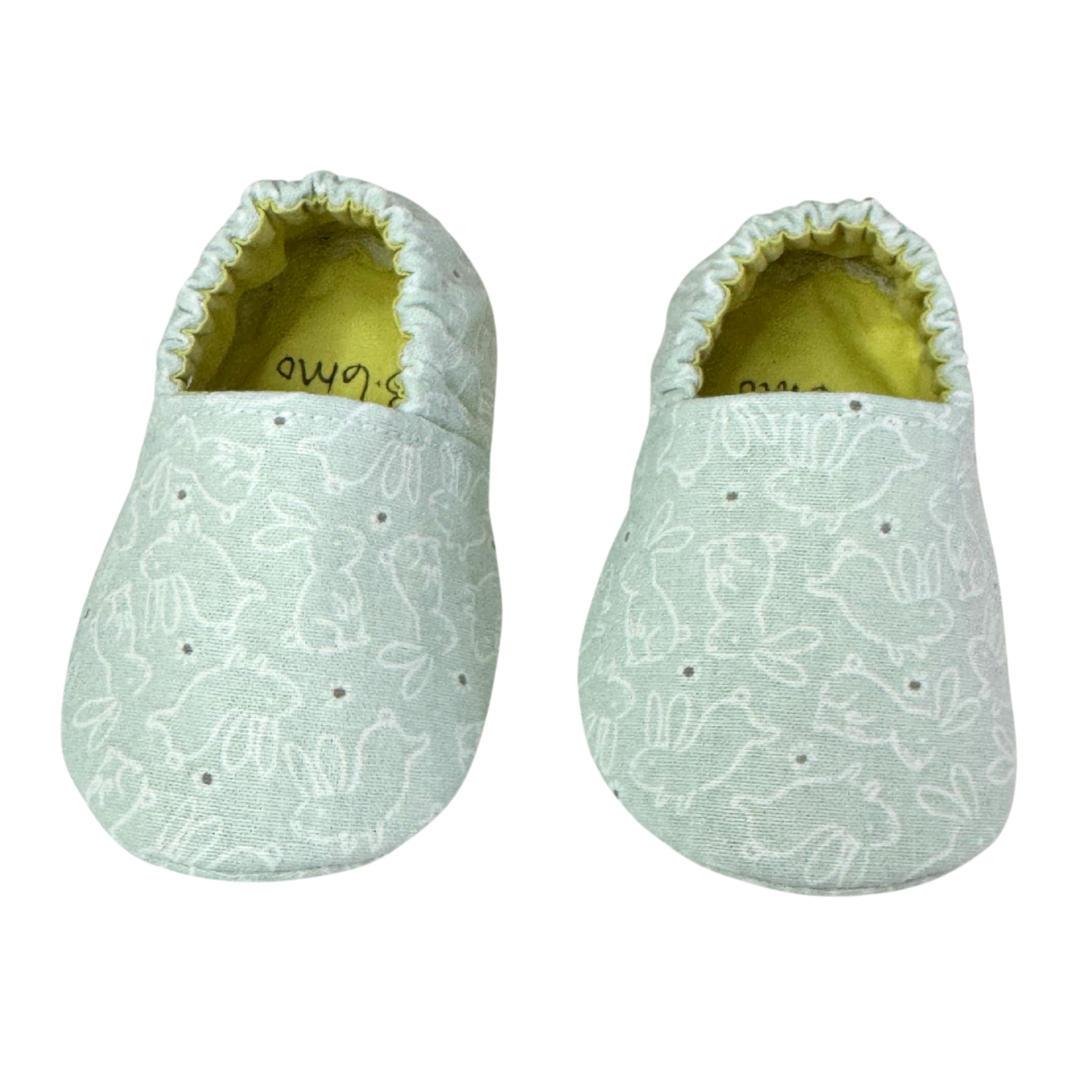 “Handmade baby moccasins with mint green bunny line art print, front view, 3-6 months”

