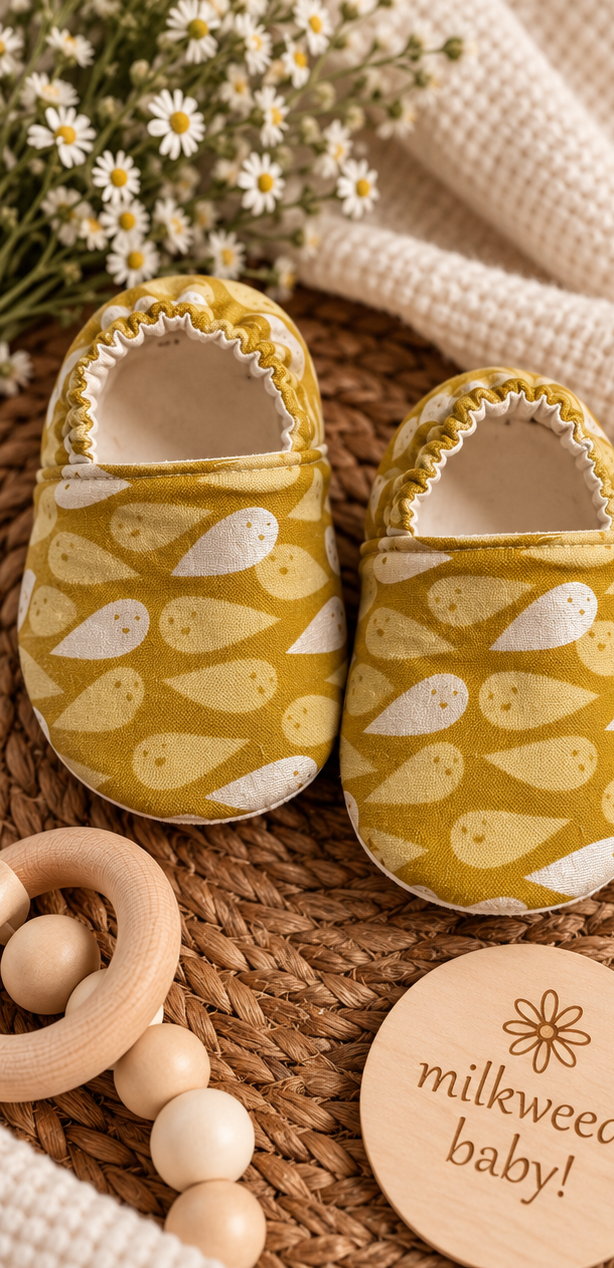 Handmade mustard cotton baby shoes with cream ghost print, size 9-12 months