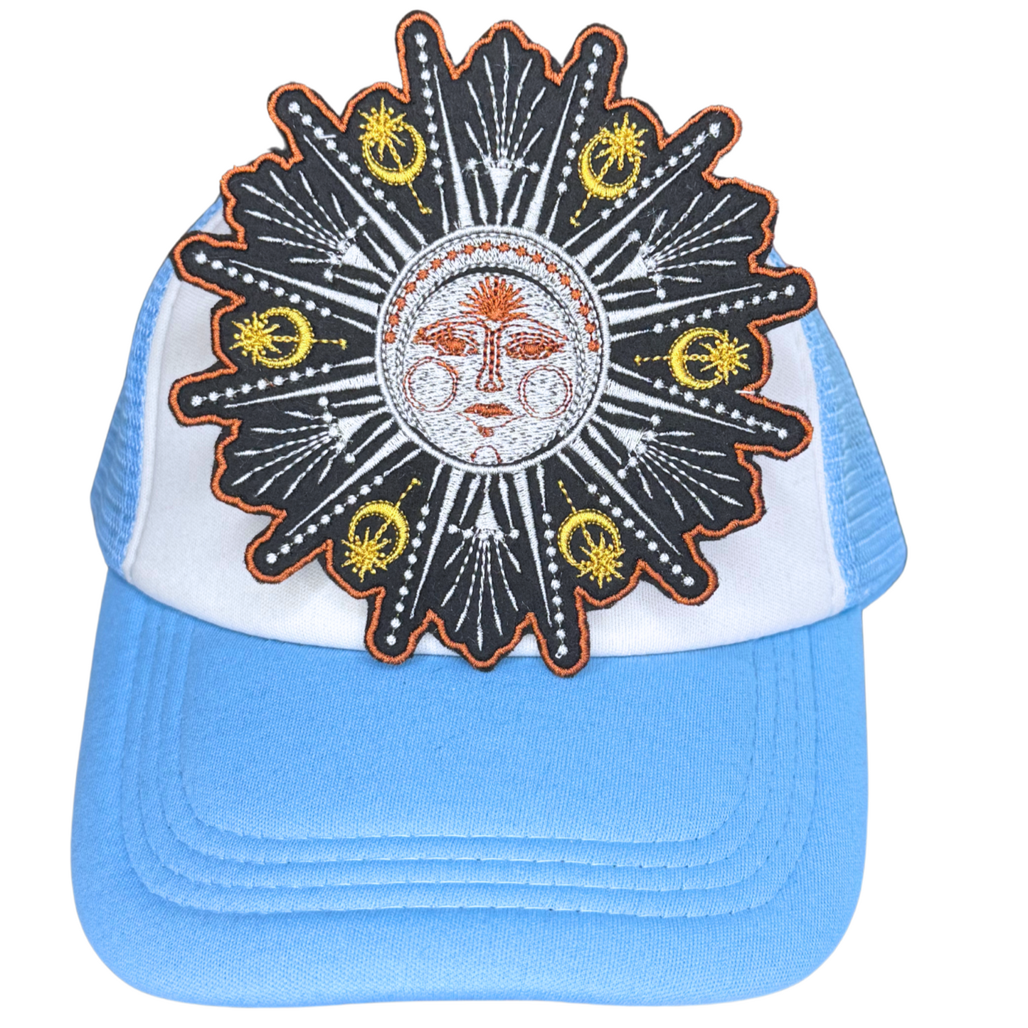 Mystical sunburst patch ironed onto blue and white trucker hat

