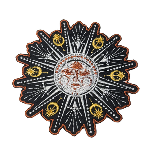 Celestial embroidered sun face patch with gold and white cosmic rays
