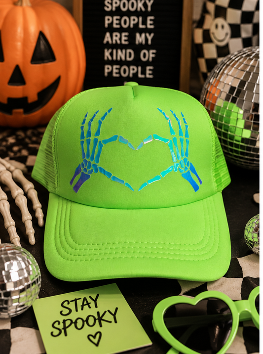 Neon green skeleton heart trucker hat styled for Halloween