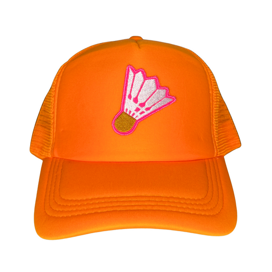 Orange cap with a white and yellow shuttlecock on a pink background