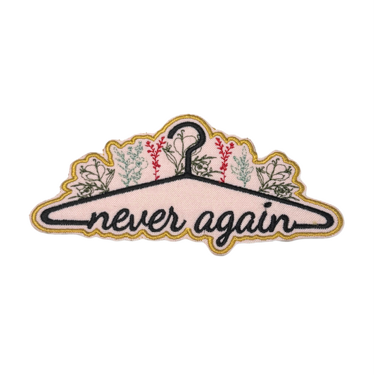 Embroidered "Never Again" patch with floral coat hanger design
