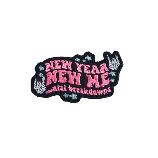 Handmade "New Year, New Me...ntal Breakdowns" embroidered patch with pink text, blue stars, and black background.
