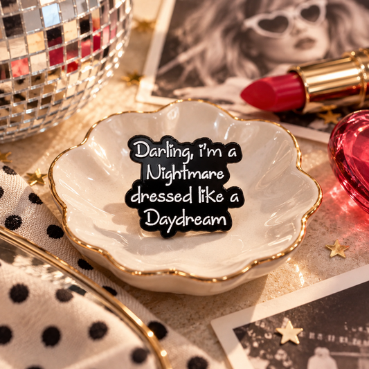 Nightmare Dressed Like a Daydream black and white enamel pin styled hero image