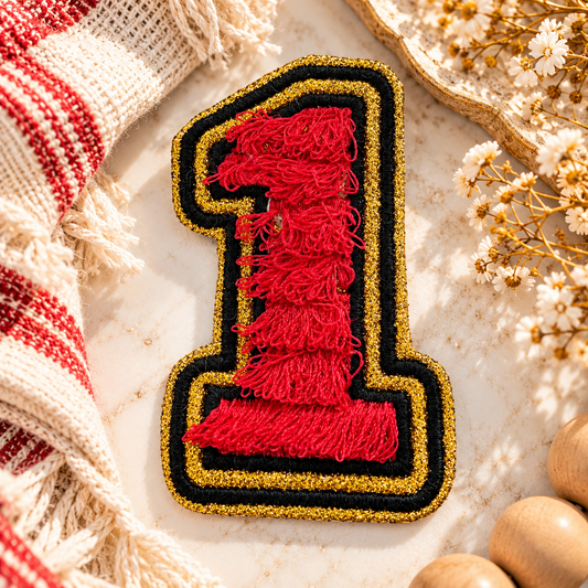#1 red, gold and black embroidered iron-on patch styled in a warm Kansas City-inspired hero scene