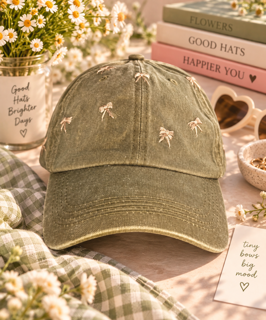 Hand-embroidered olive bow hat styled with daisies and boutique accessories