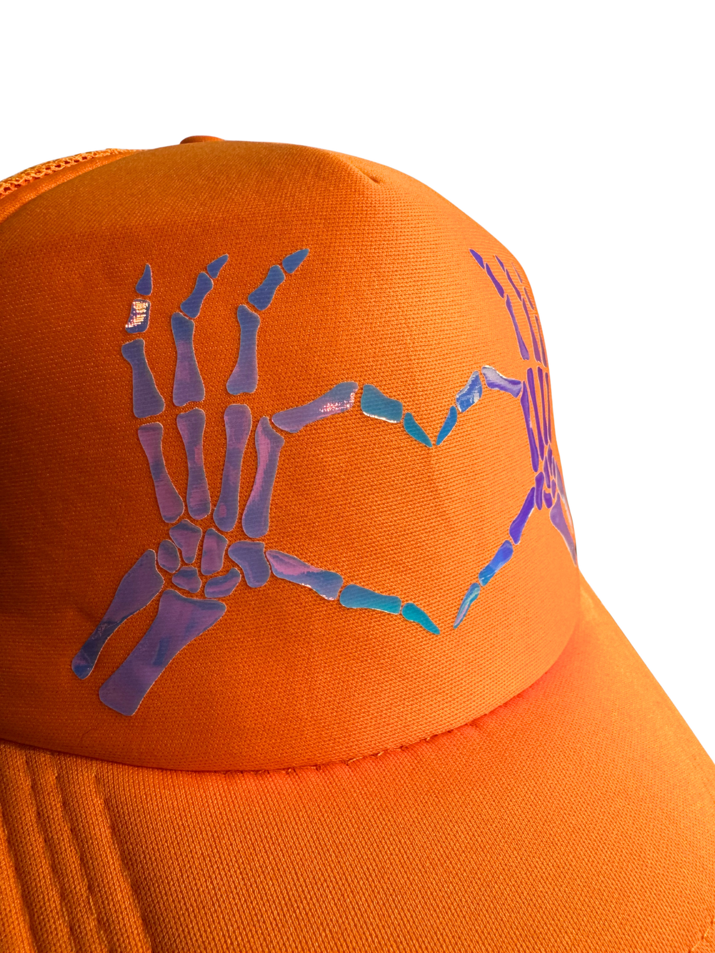 Orange cap with blue and purple skeleton hand design on a white background