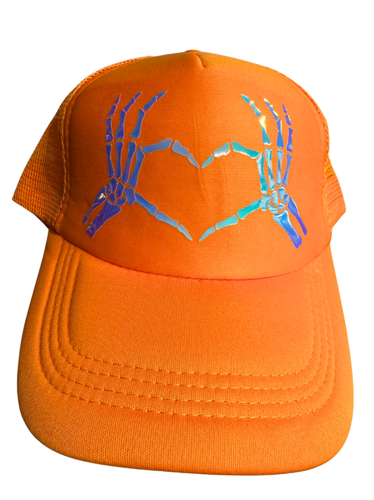 Orange cap with skeleton hand design on a white background