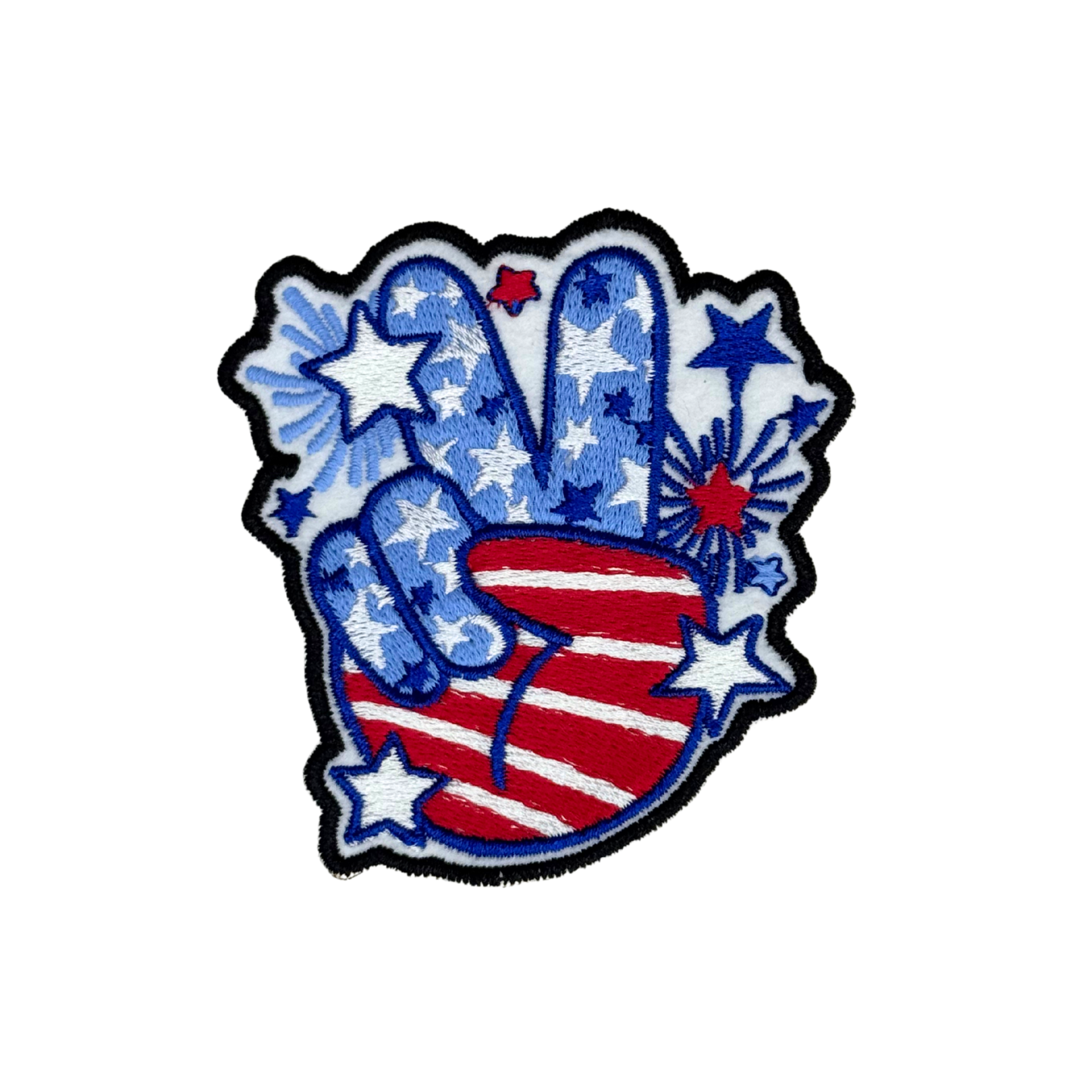 Handmade red, white, and blue peace sign patch on white background