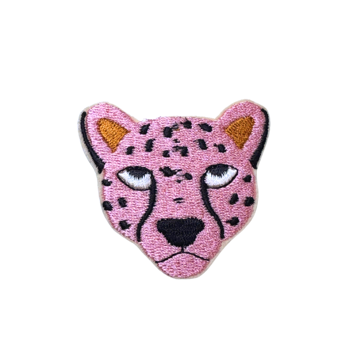 Close-up of a pink cheetah embroidered iron-on patch with black spots and golden ears.

