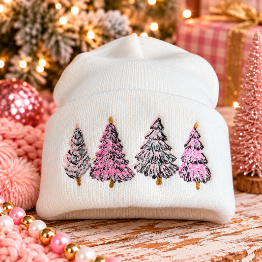 Winter white beanie with four pink and green embroidered Christmas trees in a festive holiday scene