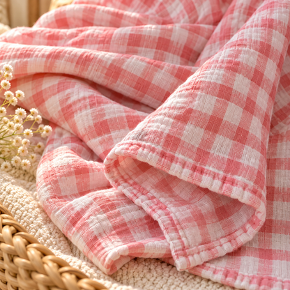 Pink gingham cotton gauze baby swaddle fabric texture and finished edge