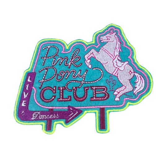 Embroidered patch featuring a vintage neon-inspired sign with "Pink Pony Club" lettering, a rearing horse, and a bold retro aesthetic.
