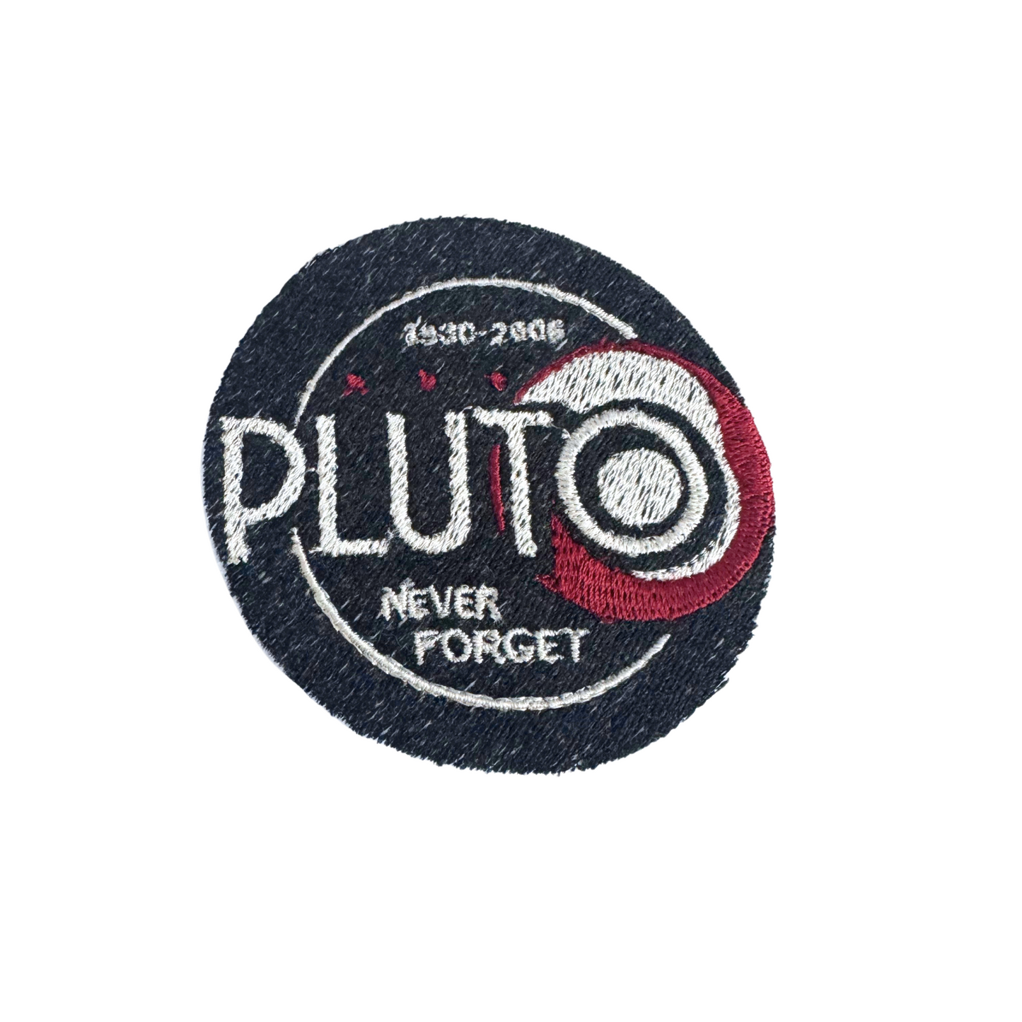 Handmade "Pluto Never Forget" embroidered patch with navy, white, and red details.
