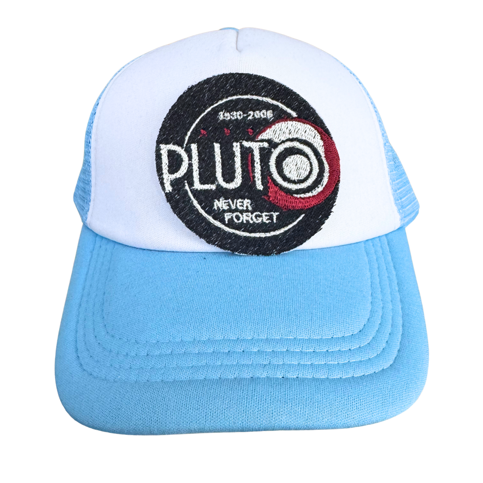 Blue and white trucker hat featuring the "Pluto Never Forget" embroidered patch, handmade and styled for space lovers.
