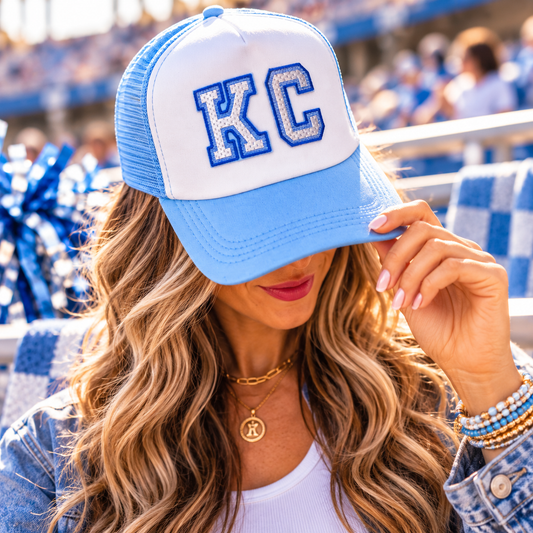 Powder Blue and White KC Trucker Hat worn at baseball game