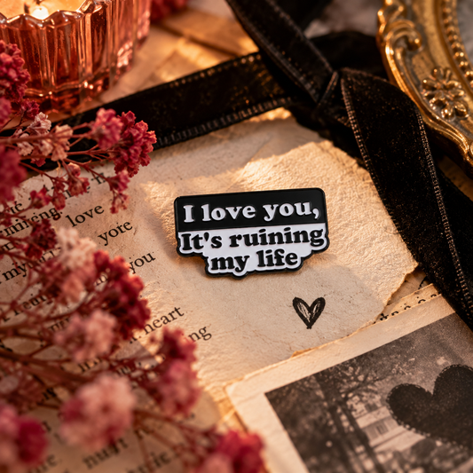 Black and white quote enamel pin styled product photo