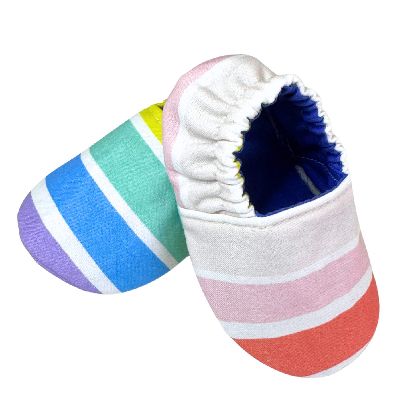 “Side angle of soft sole baby shoes featuring colorful stripes and navy interior, handmade 3–6 month size”

