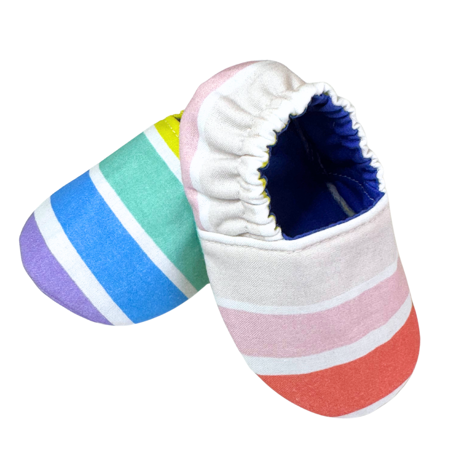 “Side angle of soft sole baby shoes featuring colorful stripes and navy interior, handmade 3–6 month size”

