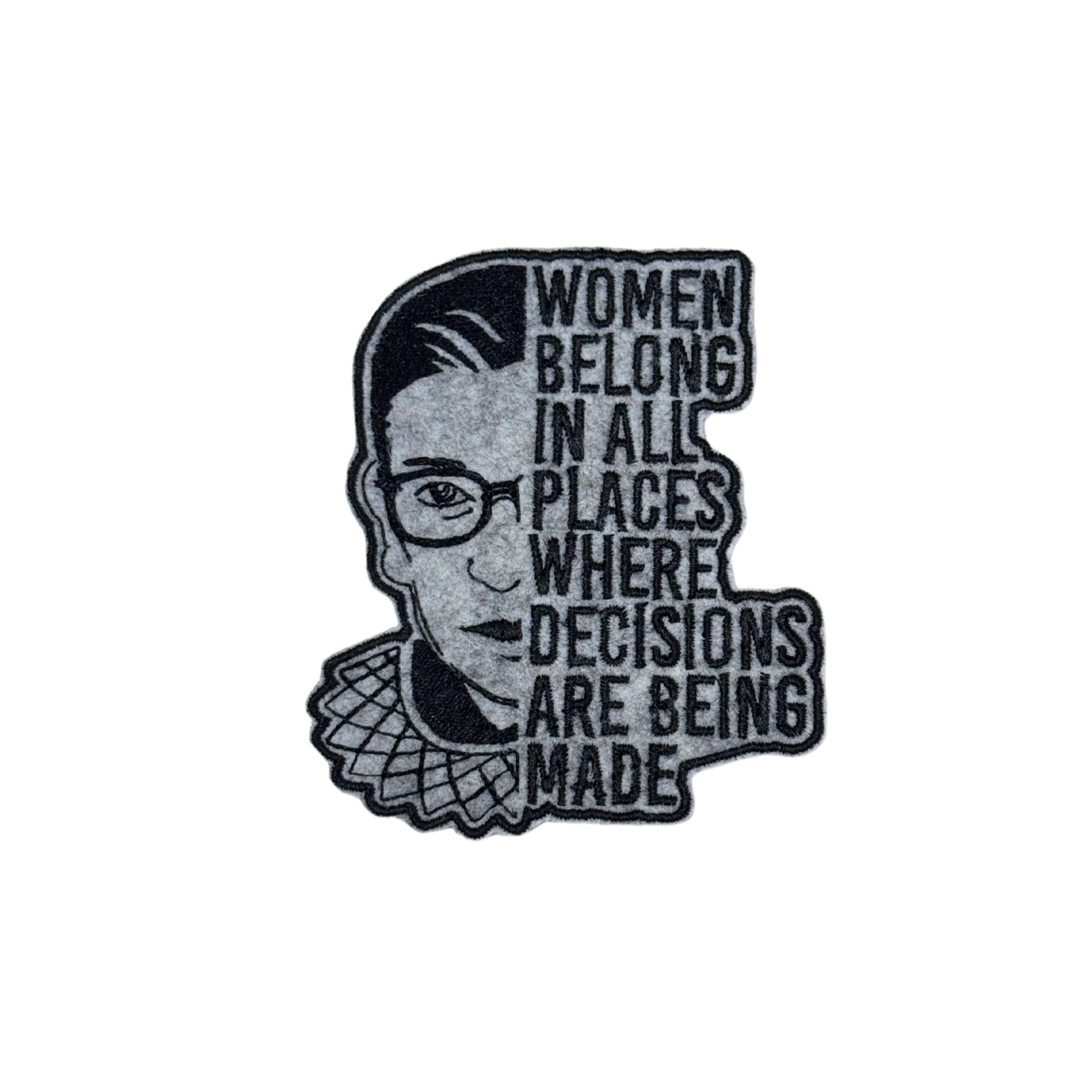 "Embroidered patch featuring Ruth Bader Ginsburg's face with the quote 'Women belong in all places where decisions are being made' in bold text."
