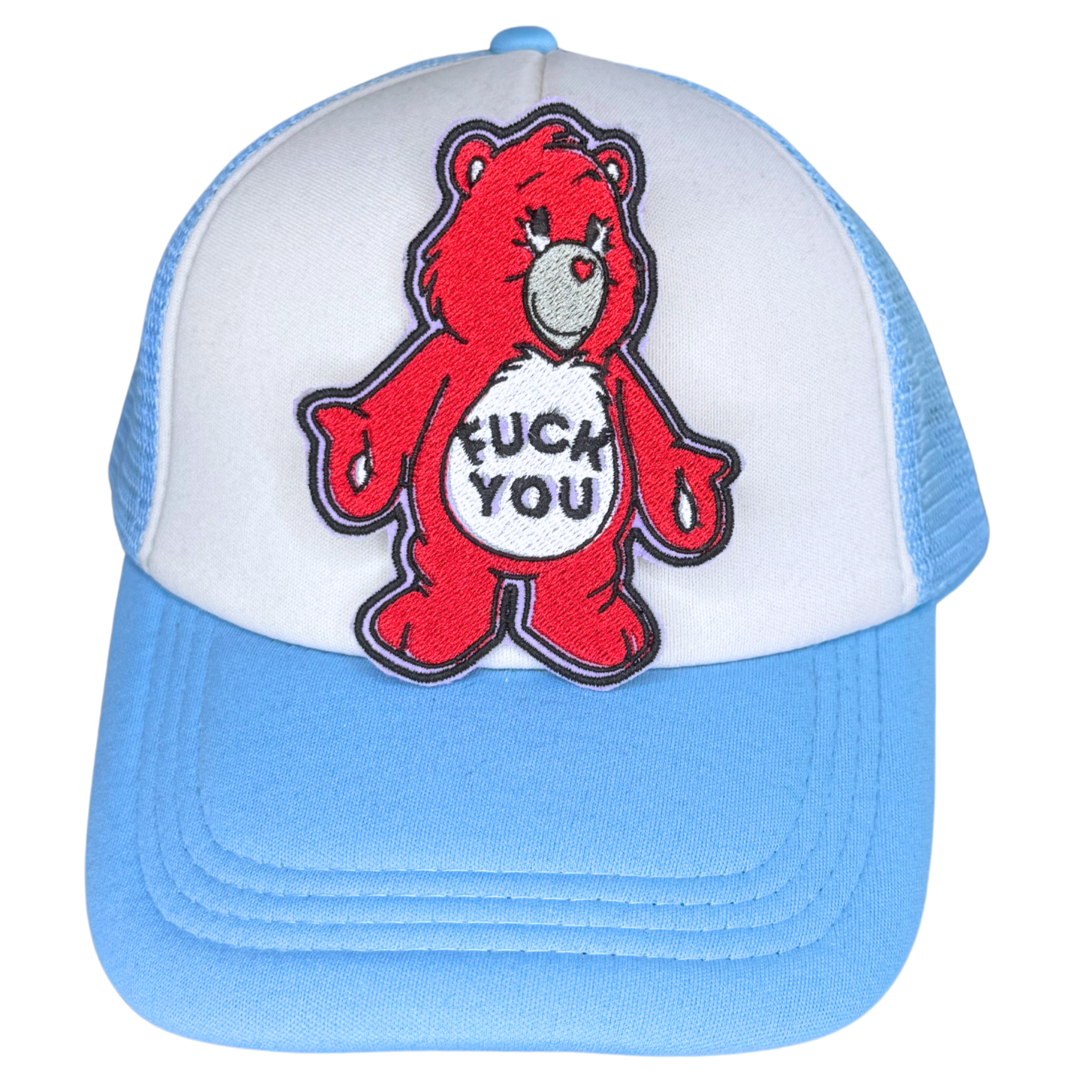 Red bear patch ironed onto blue and white trucker hat

