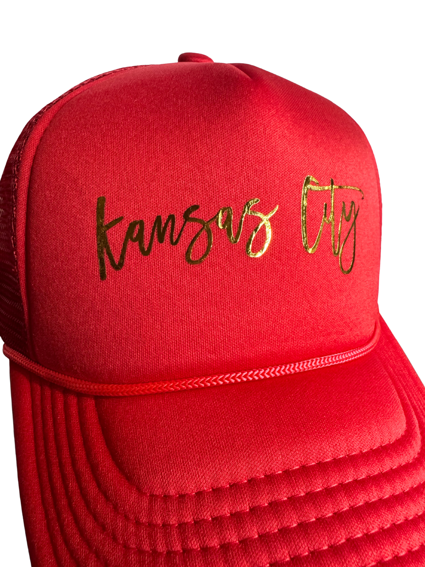 Red cap with 'Kansas City' heat pressed in gold on a white background