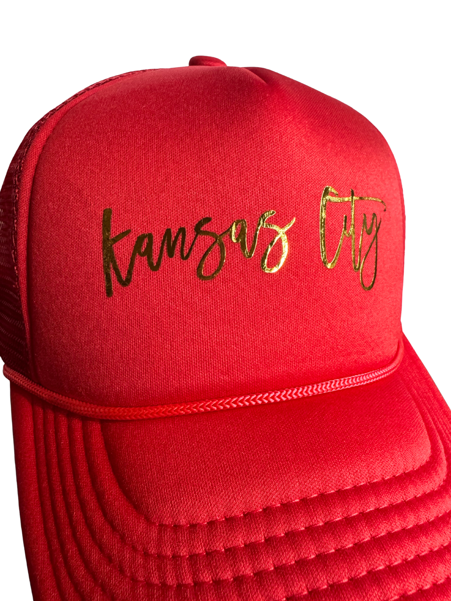 Red cap with 'Kansas City' heat pressed in gold on a white background