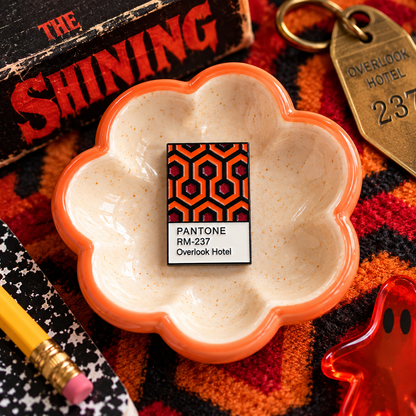 Retro hotel carpet enamel pin hero image
