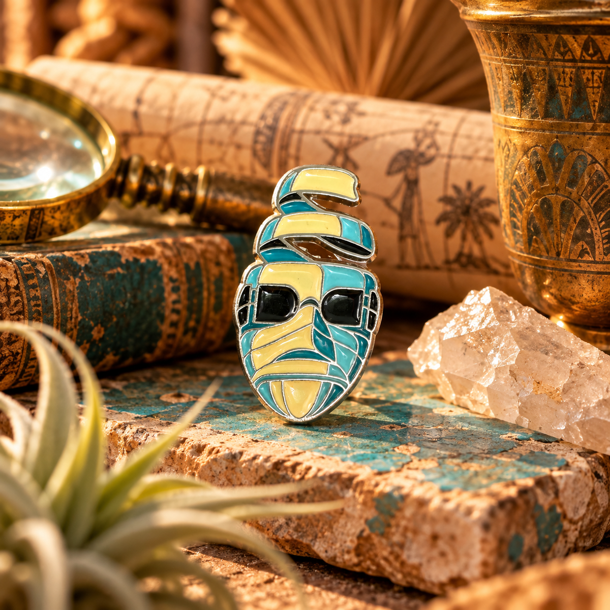 Colorful retro mummy enamel pin styled in a vintage archaeological scene