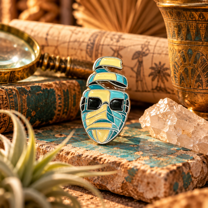 Colorful retro mummy enamel pin styled in a vintage archaeological scene