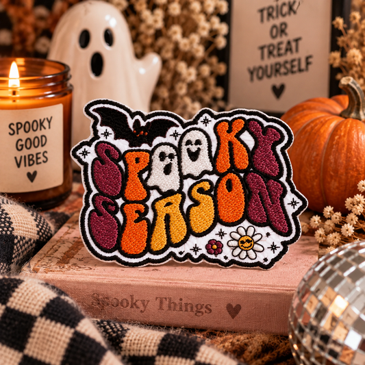 Retro Spooky Season embroidered patch styled with warm Halloween decor