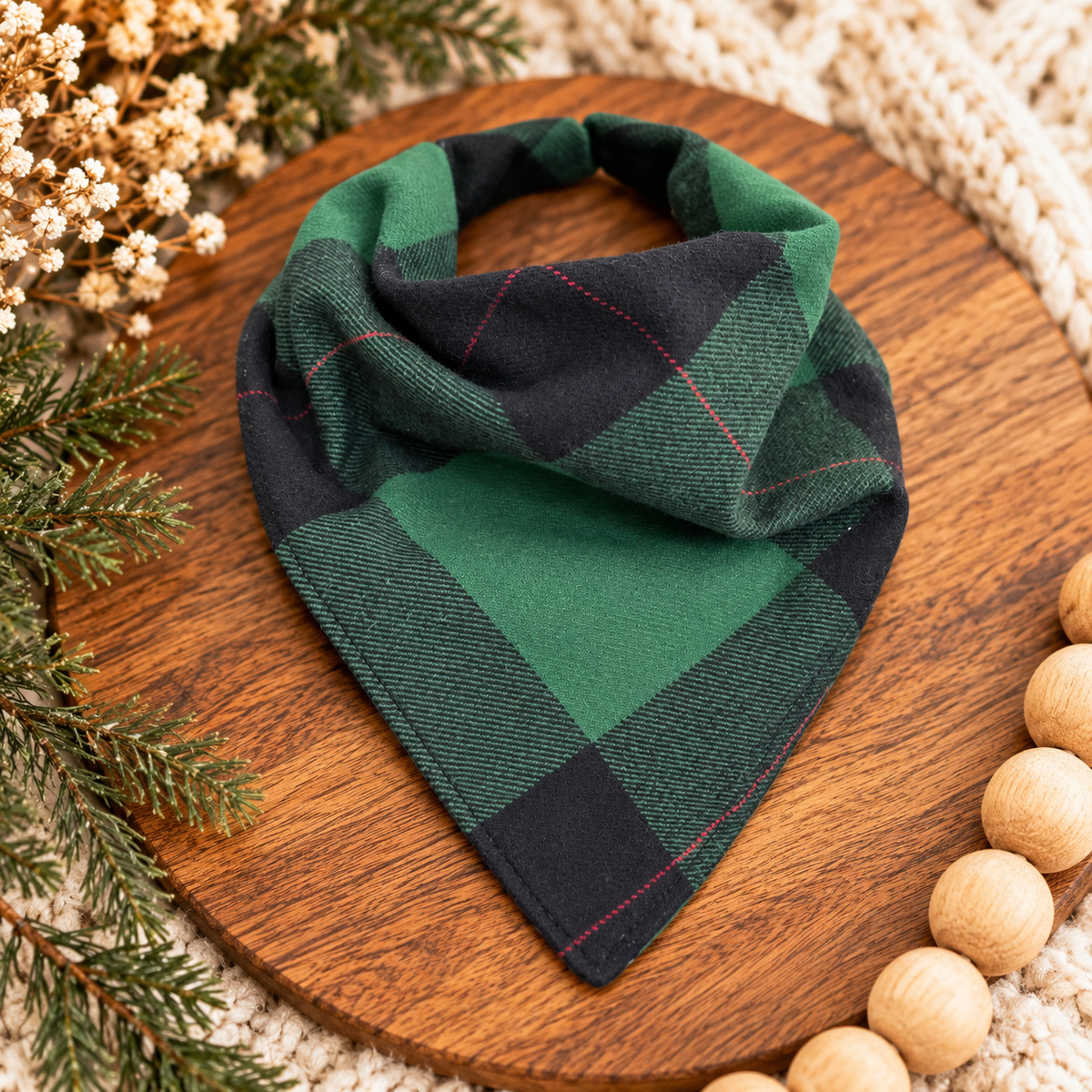 Reversible green and black plaid bib-dana styled on warm wood