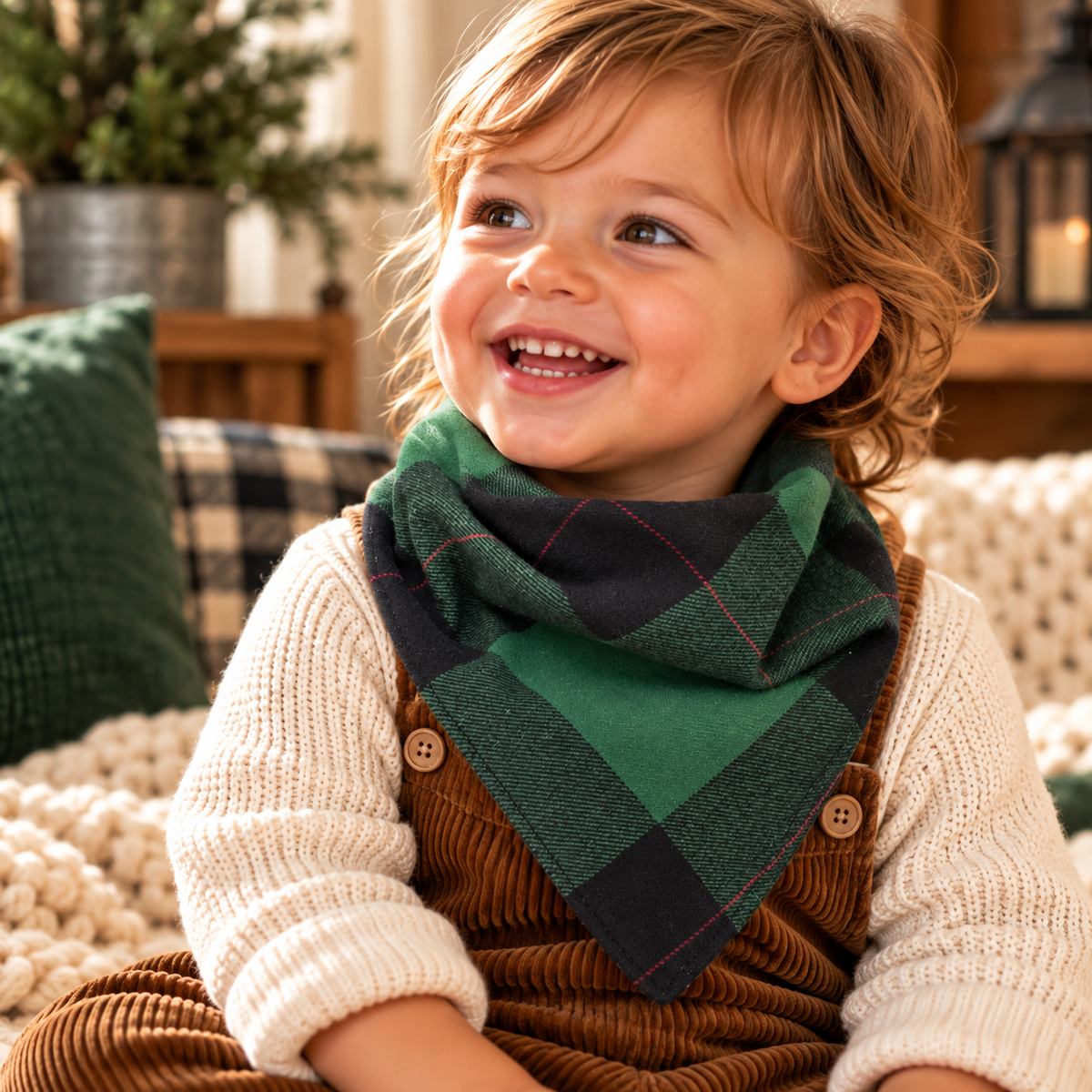 Toddler wearing reversible green and black plaid bib-dana