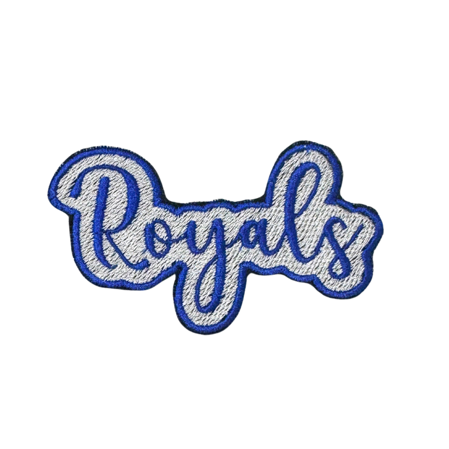 Close-up of blue and white embroidered “Royals” iron-on patch in cursive script
