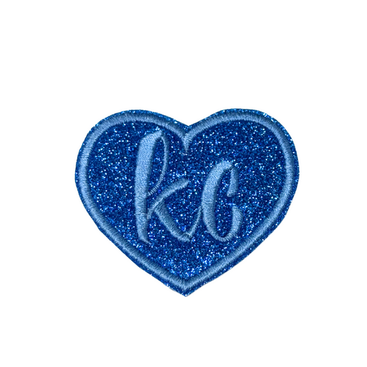 Blue glitter heart patch with light blue “kc” embroidery and matching border, inspired by Kansas City Royals colors

