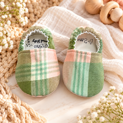 Sage plaid soft sole baby moccasins in green, blush and cream, size 0–3 months