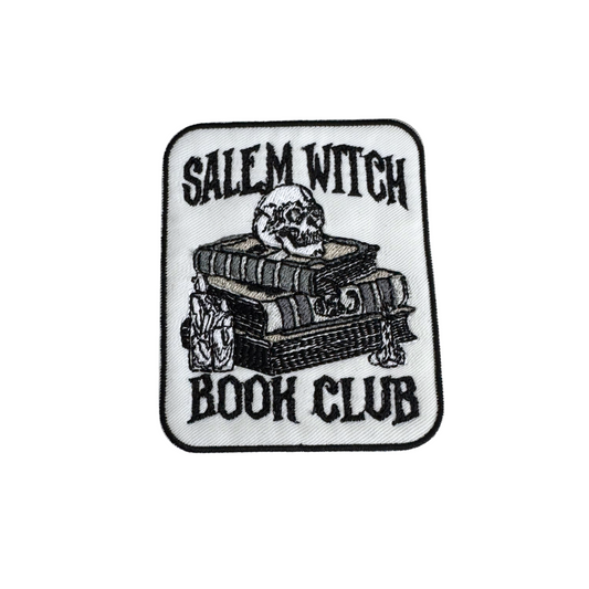 Handmade "Salem Witch Book Club" embroidered patch featuring books, a skull, and gothic text on a white background.
