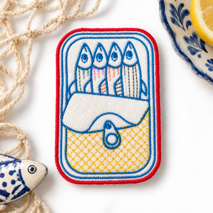 Sardine tin embroidered patch with red, blue and yellow stitching