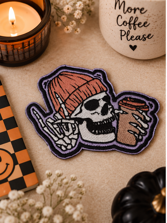 Skull and Coffee embroidered iron-on patch styled with cozy spooky coffee accents