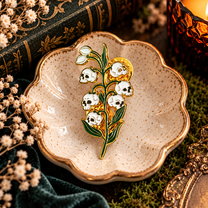 Skull lily of the valley gothic botanical enamel pin hero image