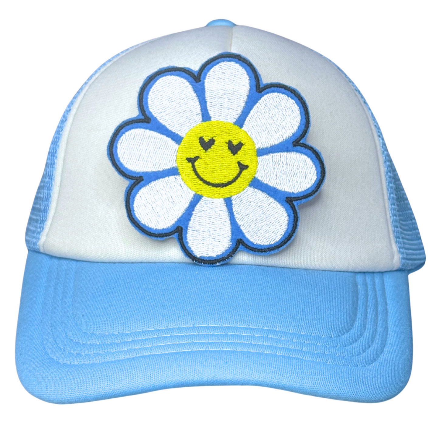 Blue daisy smiley patch ironed onto white and blue trucker hat

